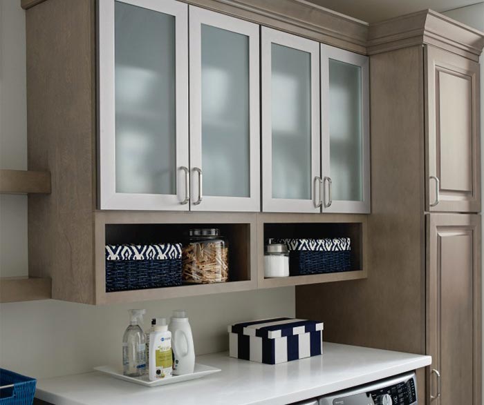 Hardin laundry room storage cabinets in Maple Seal with aluminum framed doors
