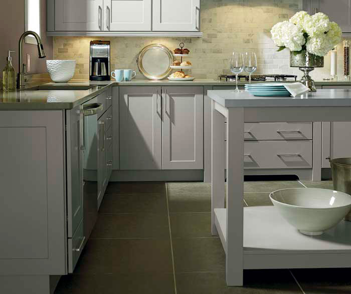 Light grey kitchen cabinets by Kemper Cabinetry