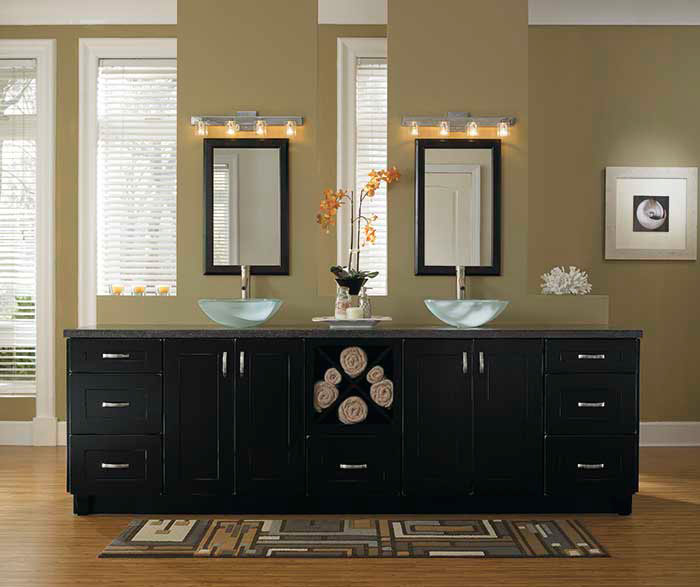 Black bathroom storage cabinets by Kemper Cabinetry